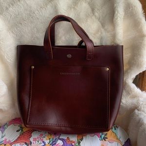 PORTLAND LEATHER ALMOST PERFECT MINI CROSSBODY COGNAC